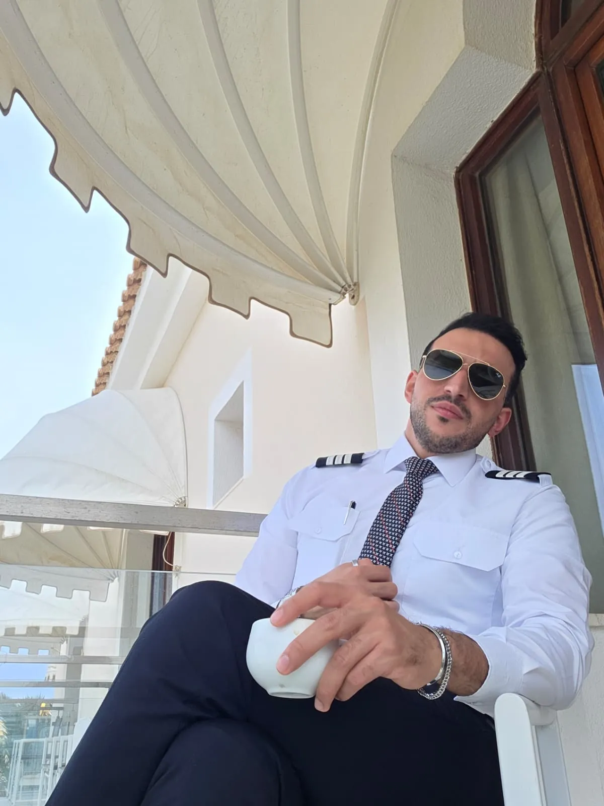 Abdollah Mohammadpour in airline pilot uniform, photographed for Asian World News