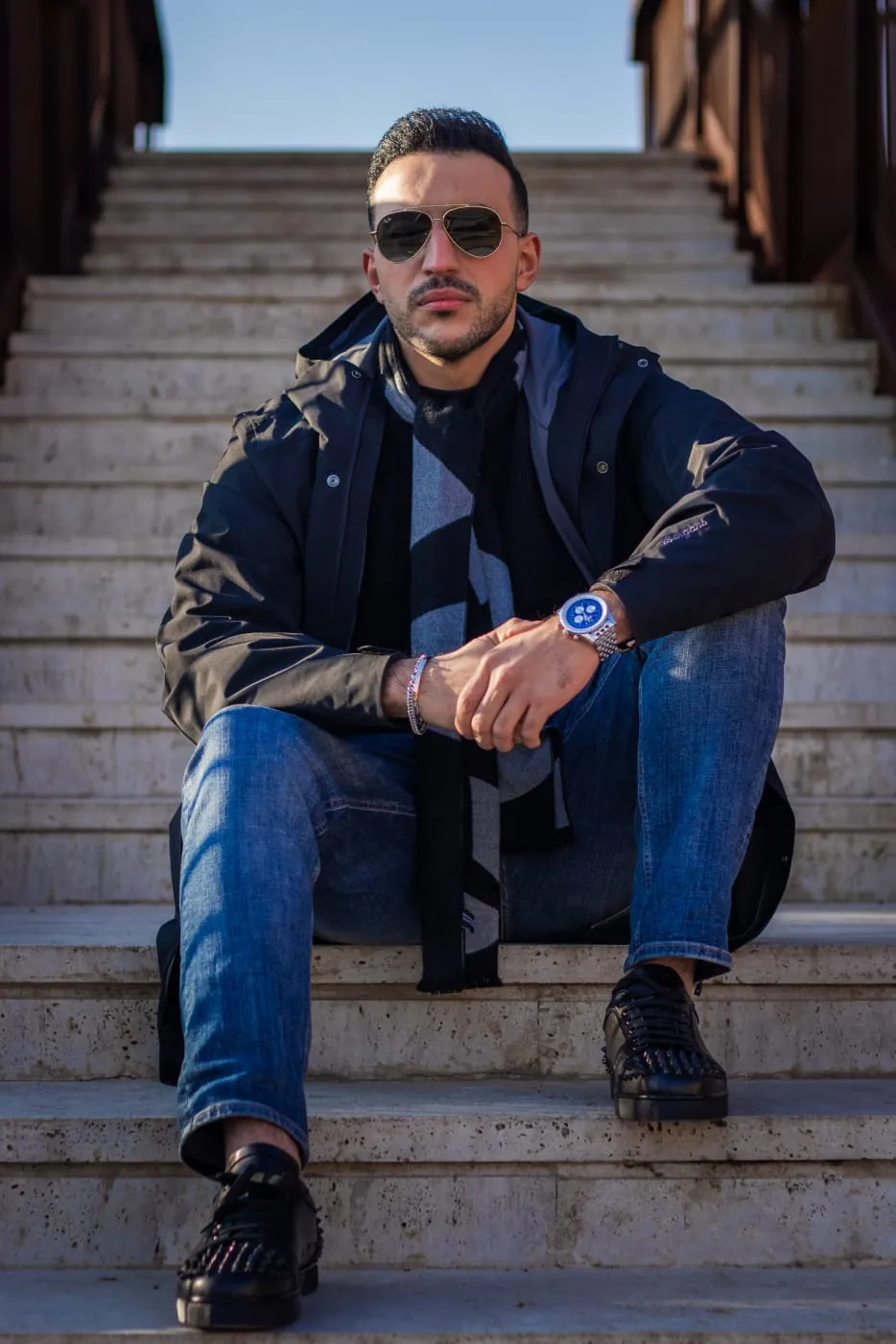 Abdollah Mohammadpour seated outdoors in casual clothing